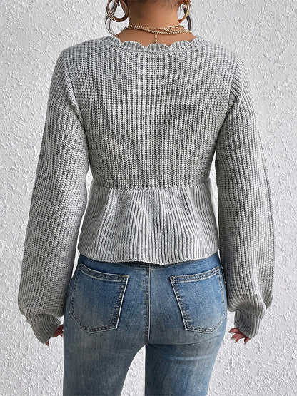 "RuffleVibe" Chic Ribbed V-Neck Peplum Sweater